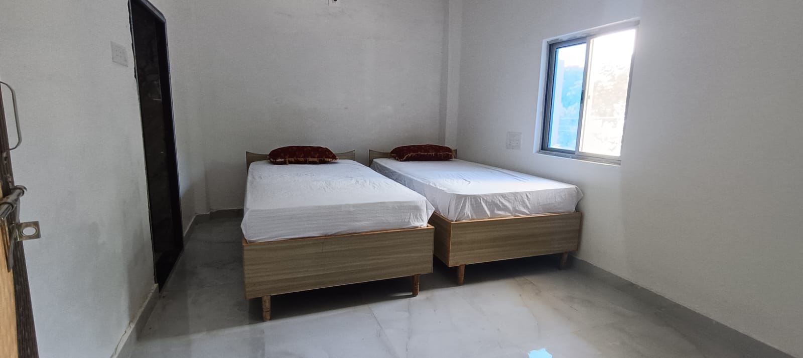 A bright twin bedroom at Anup House